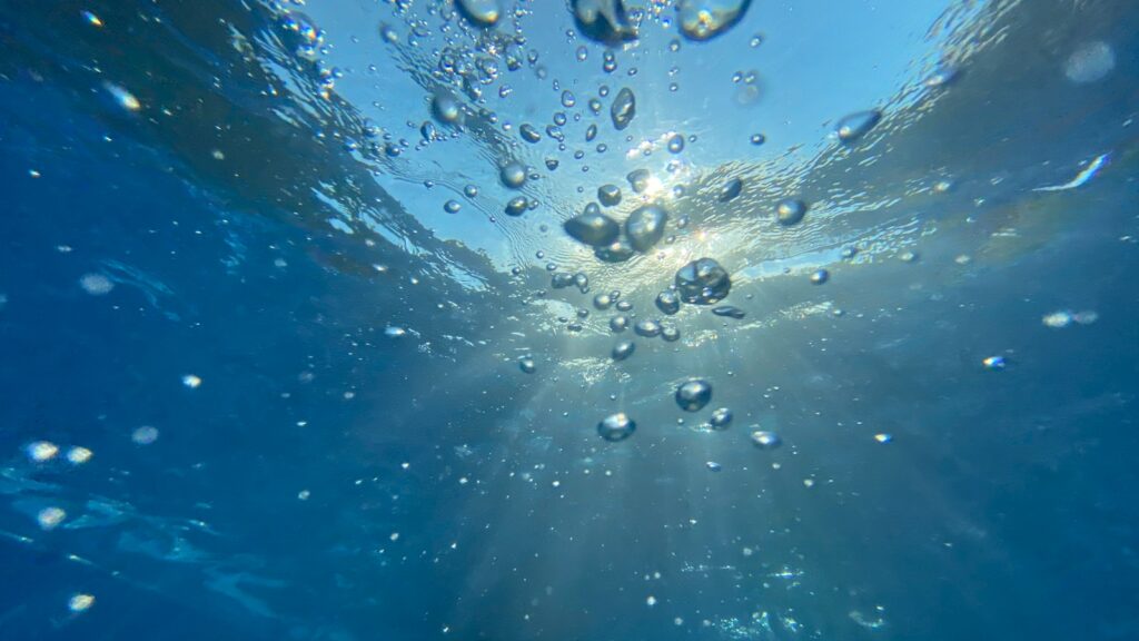 water droplets on blue surface